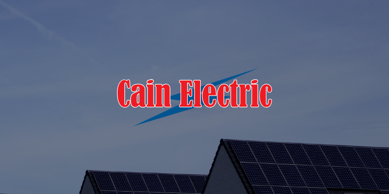 solar panels on residential roofs backdropped by sky